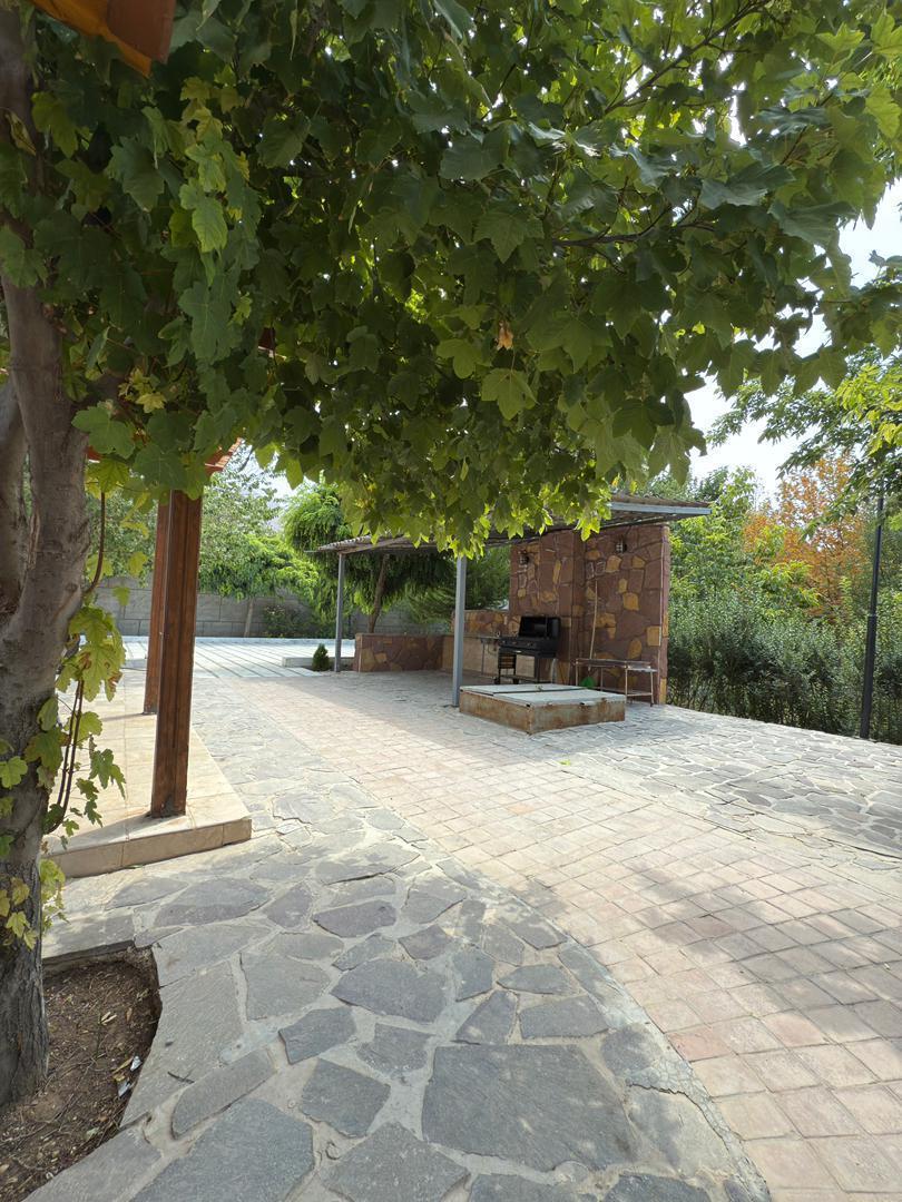 کلبه چوبی با استخر آب گرم در خان زنیان